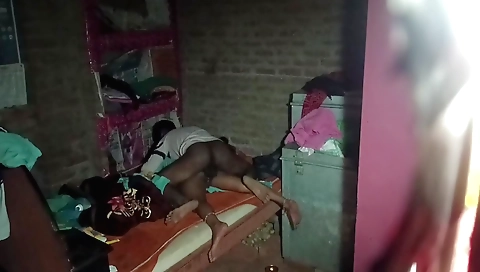 Indian wife in a black salwar suit in a black dress in the bedroom