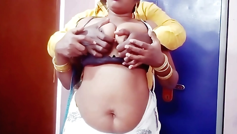 Busty brunette giving a blowjob and licking fingers