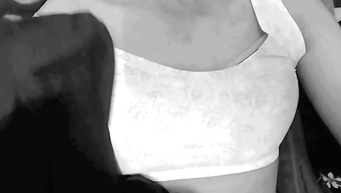 Sexy solo girl in a yellow hoodie and stockings in living room