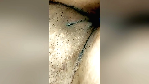 Indian with long hair is getting her hair cleaned up