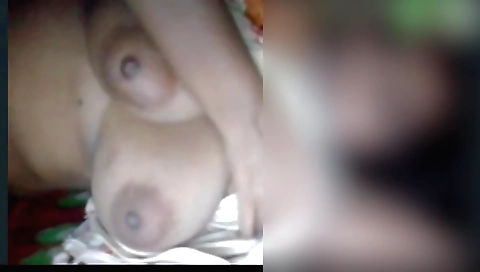 Amateur brunette girl is in front of the camera in her dress