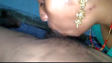 A sexy brunette in a short skirt with a long black dress