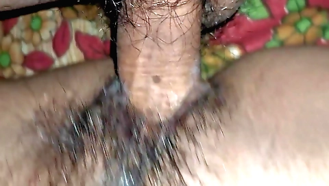 A hairy girl is receiving a creampie in her tight pussy
