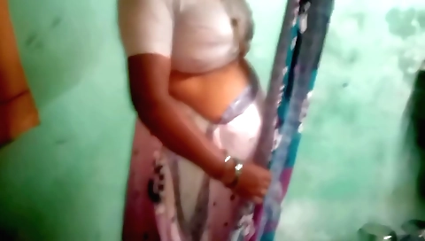 Indian amateur housewife shows her long hair and body