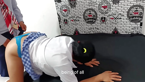 Indian teacher shows a student how to ride a motorcycle