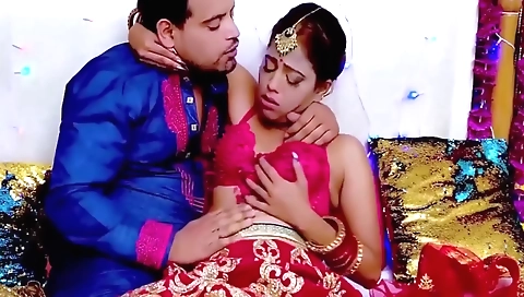 Horny brunette in a sexy outfit fucks her pussy and tits