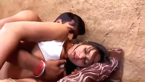 Indian hottie with big tanned boobs plays with a big dick