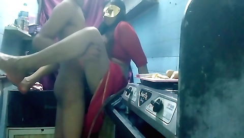 Indian brunette in a white bikini and black shorts