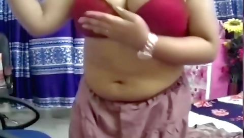 Hot brunette in a sexy outfit video showing her tits