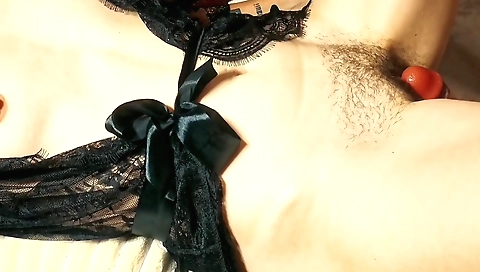 Indian hairy amateur girl rubs her pussy against dildo